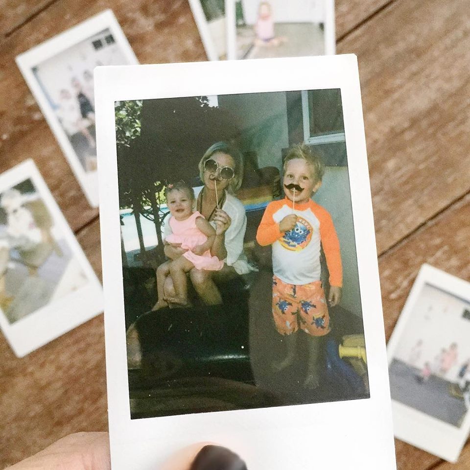 Instax camera photograph of a family