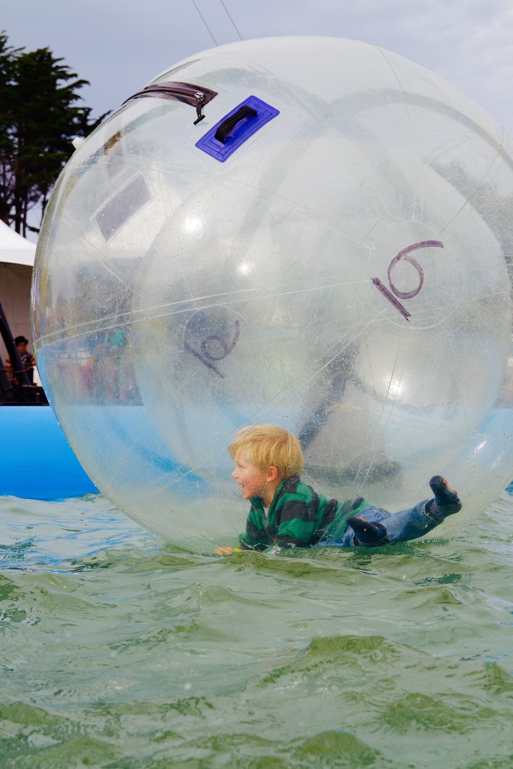 In a rolling water ball at a fair