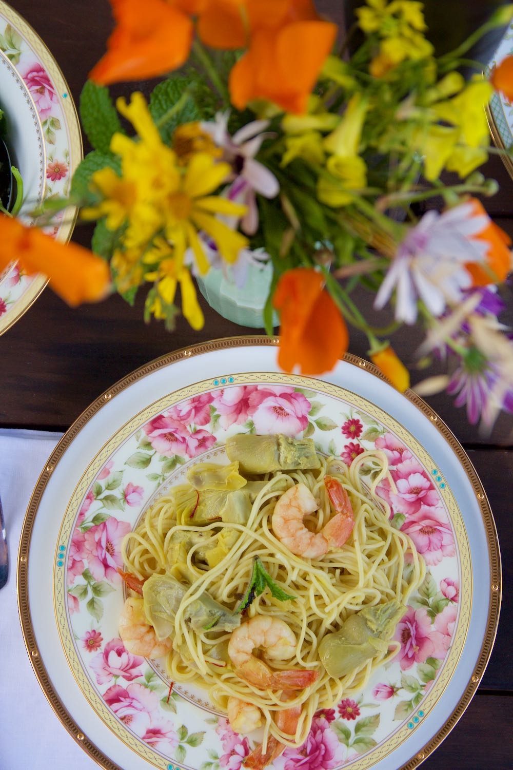 Spring pasta dish with vegetables and shrimp