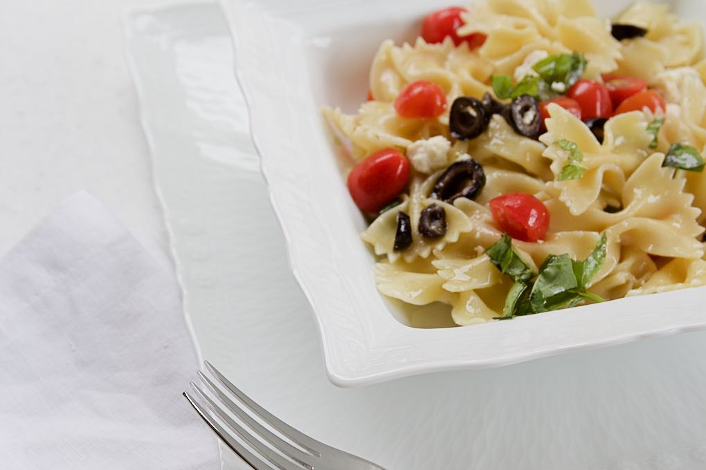 Farfalle pasta with cotija cheese and tomatoes