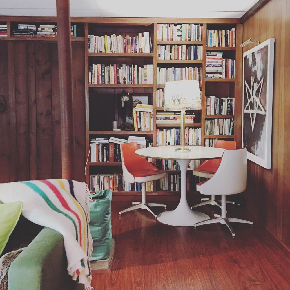 Midcentury modern family room with built in bookshelf