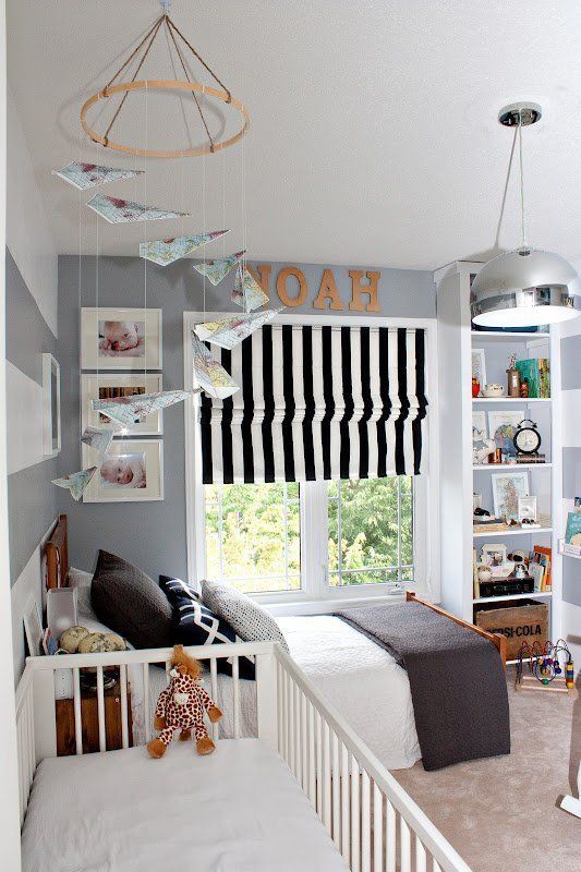 Sweet shared bedroom for little boys with a crib