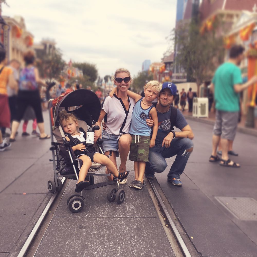 family of four with two toddlers at disneyland