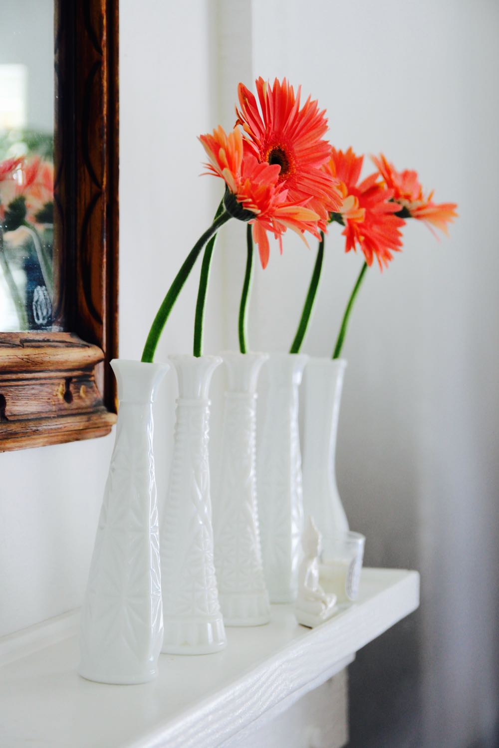 how to style a simple flower arrangement on a mantle