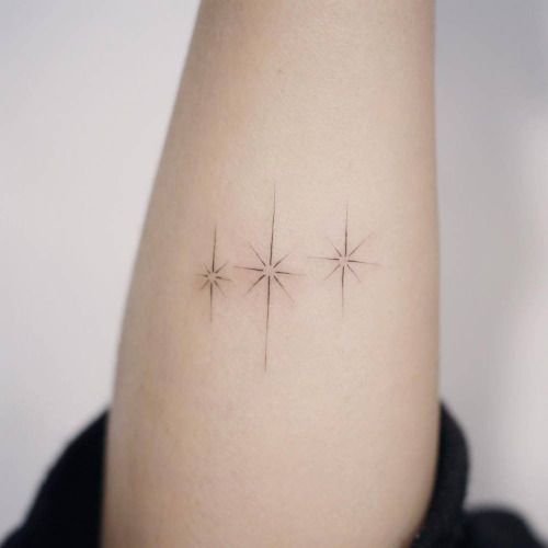 tiny three stars tattoo in fine line
