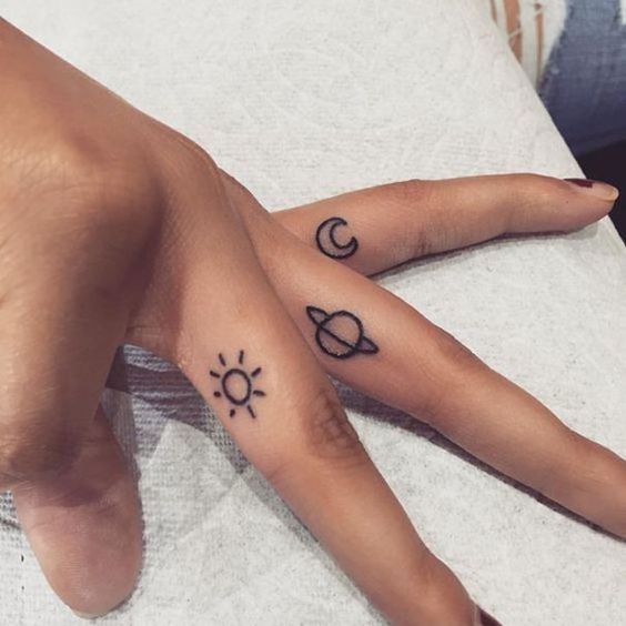tiny sun moon stars tattoos on fingers