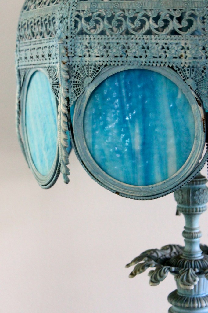 large wrought iron base lamp with translucent blue glass panels