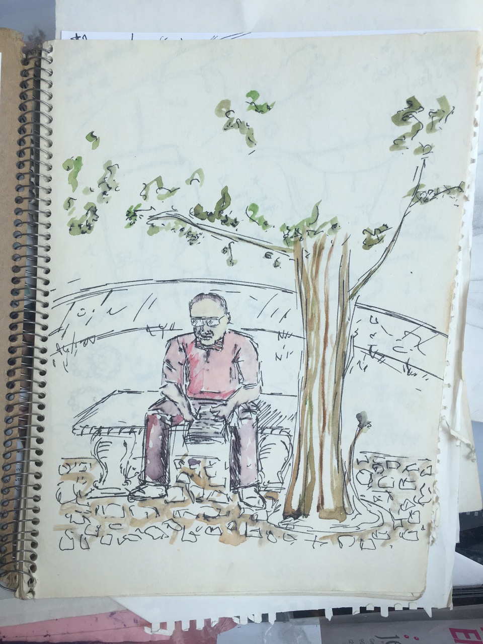 watercolor of man sitting on park bench