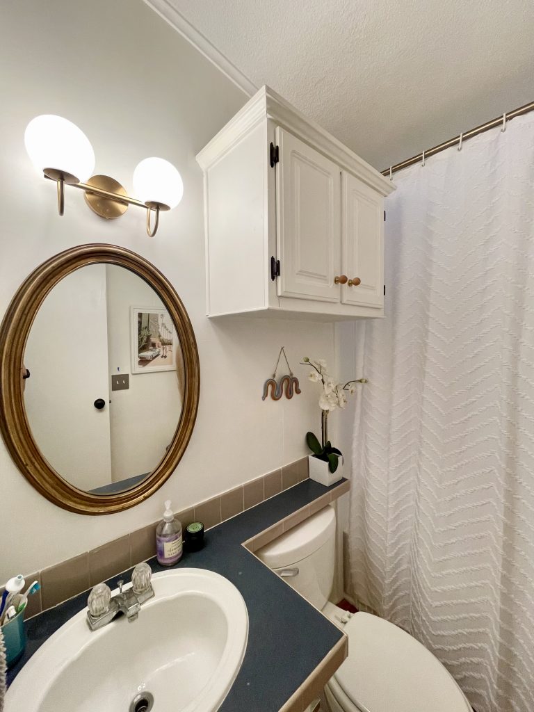 before and after dated hallway bathroom